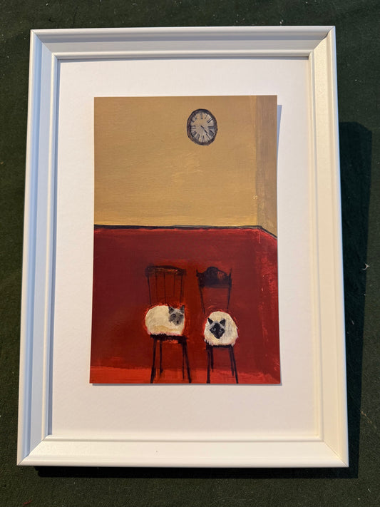 Siamese cats in a railway waiting room framed print