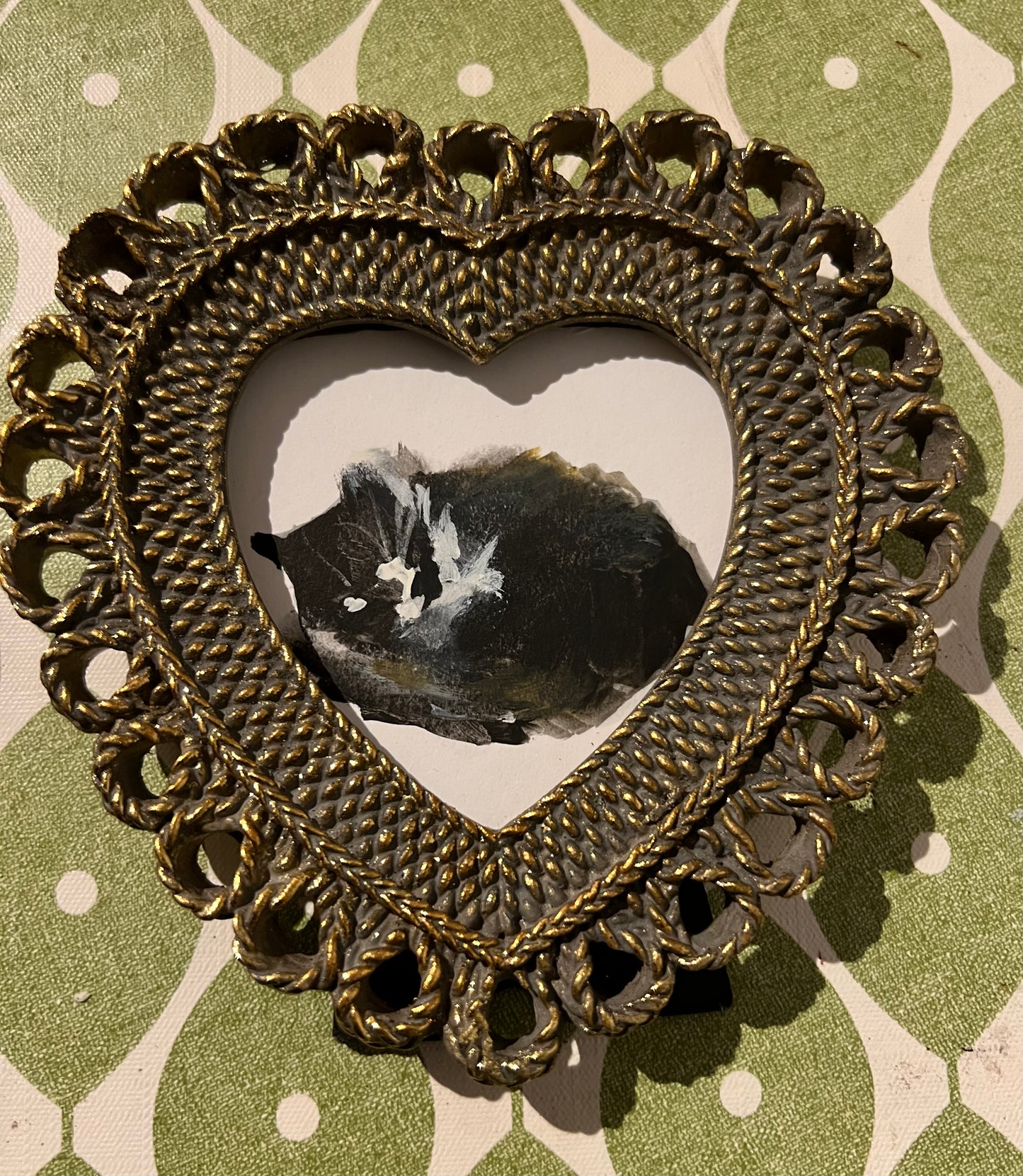 Original painting of Flash asleep in a brass heart shaped frame